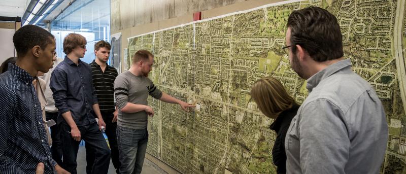Planning Graduate Students Review Map During Studio