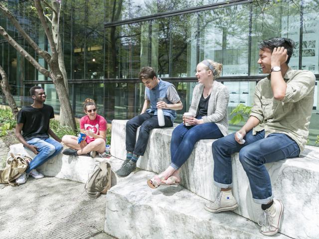 Students relaxing in the South Cutout Garden