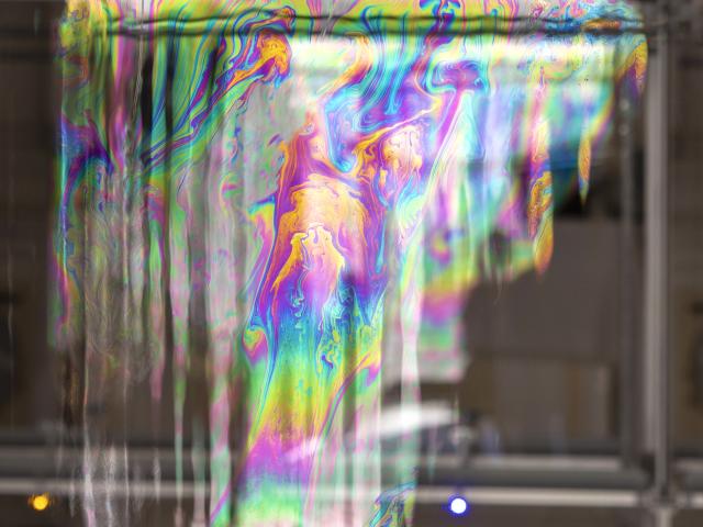 Soap bubble showing a swirl of rainbow colors