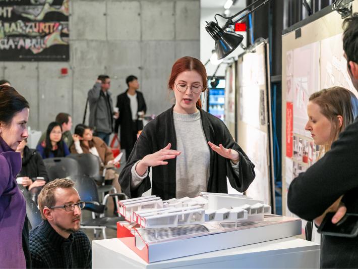 Senior architecture student presenting model during Gui Competition
