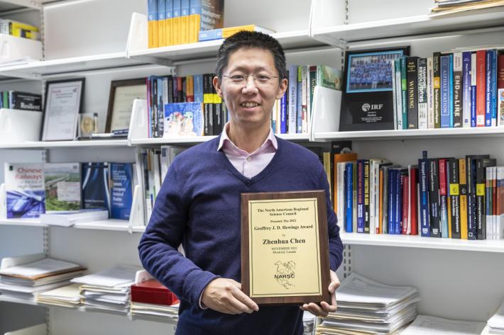 Zhenhua Chen with 2022 Geoffrey J. D. Hewings Award