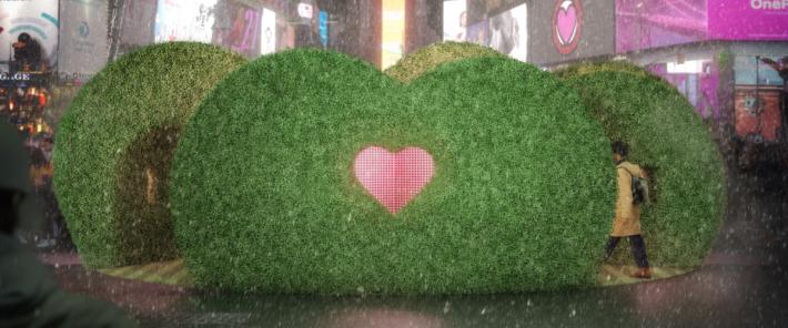 a pedestrian walks into a heart-shaped hedge in the Love’s h/Edge proposal